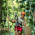 camper on rope course